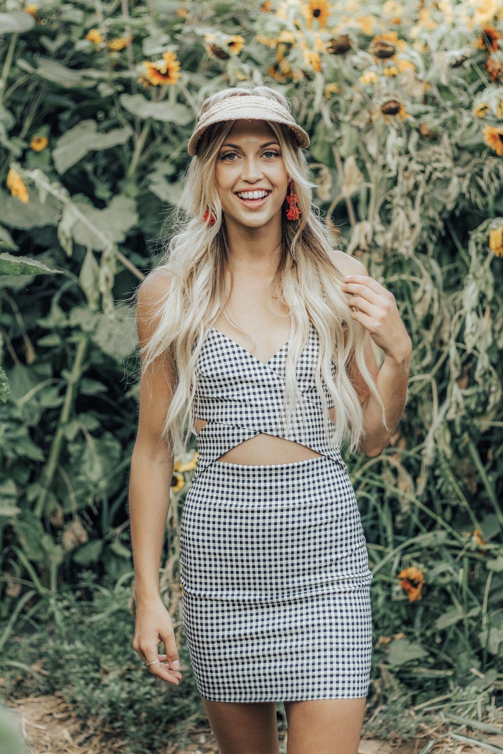 Woman with long blonde hair in a sunflower field
